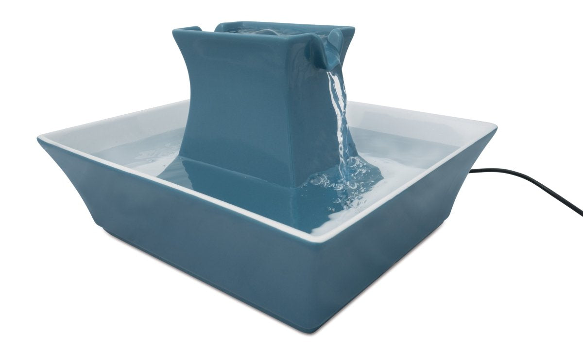 Buy now PetSafe Drinkwell Pagoda Fountain - Hygienic Ceramic Continuous Flowing Fountain - Elevated Upper Bowl & Double Free-Falling Stream Design - Minimalist Pet Hydration Station - 70 oz Capacity at indiglob india