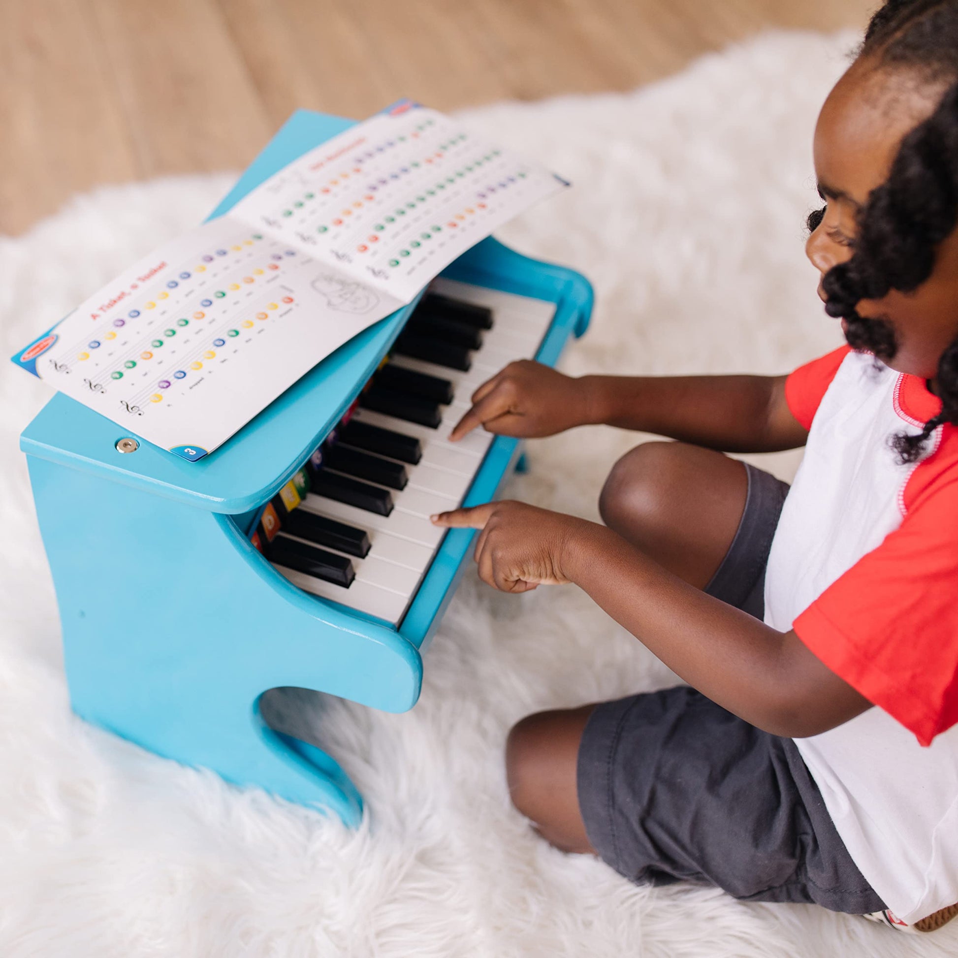 Buy now Melissa & Doug Learn-to-Play Piano with 25 Keys and Color-Coded Songbook - Blue at indiglob india