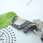 Hephis Skull Heavy Duty Key Chain,Car Emergency Escape Tool, Seat belt Cutter,Bottle Opener,Carabiner Car Key Chains